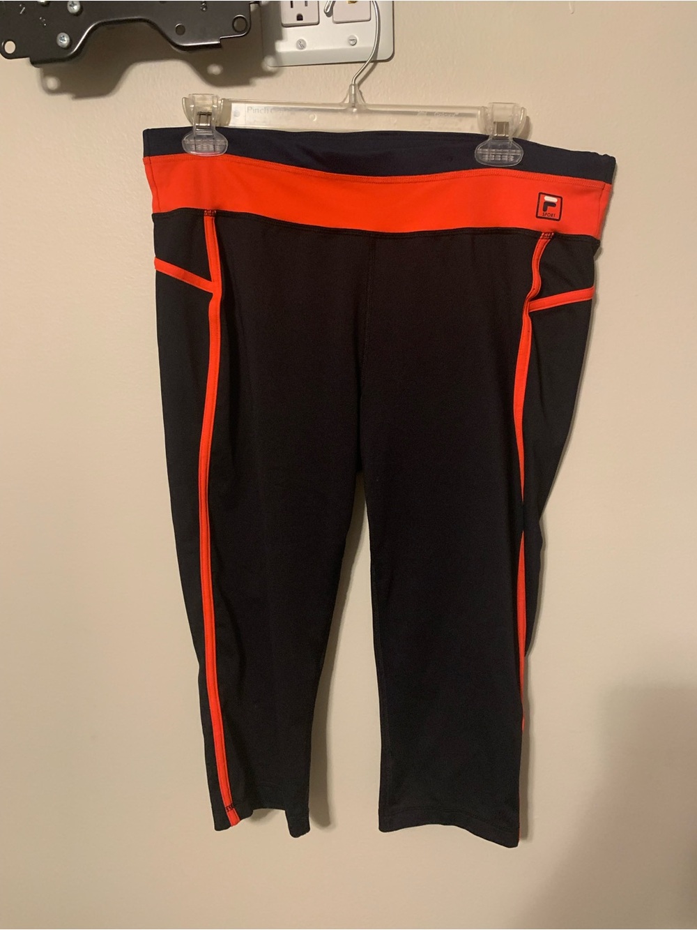 Woman’s Fila Black Track Capri Joggers with Bright Orange Trim. Size L